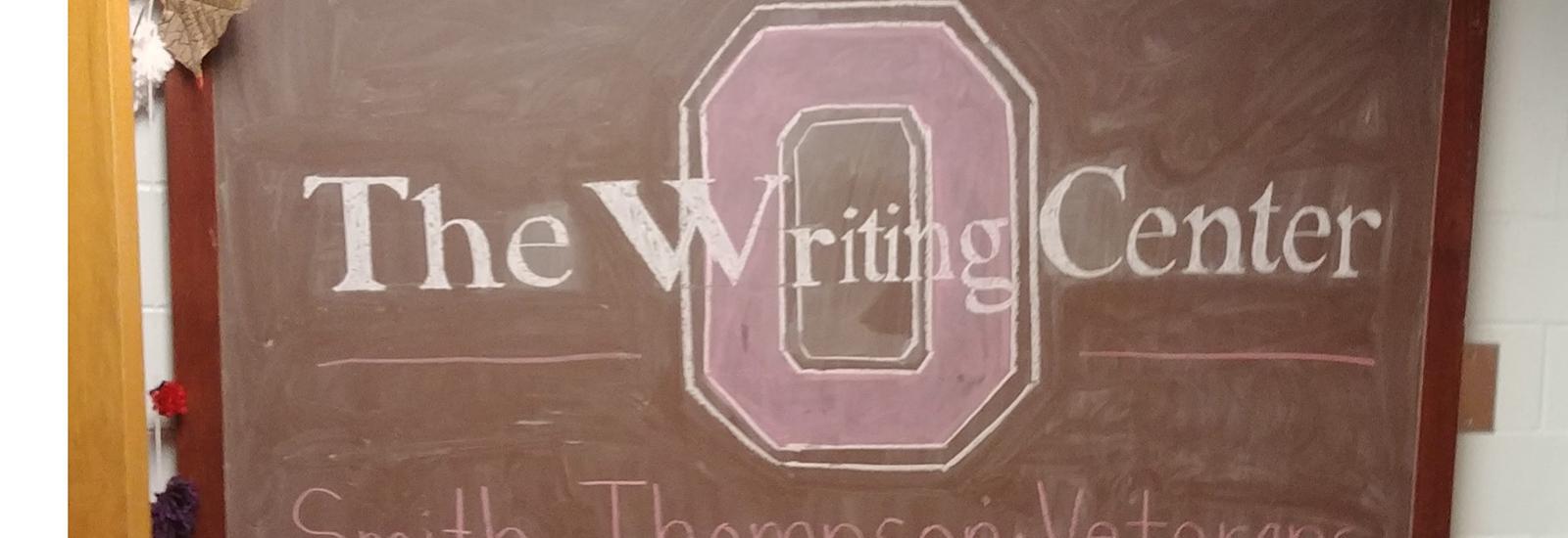 Chalk Board at Entrance to the Writing Center, with text in front of block O: CSTW Fostering Excellence, The Writing Center